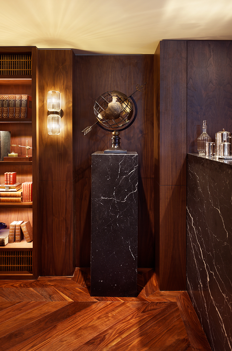 Luxury cigar lounge decoration with marble and wood interior.