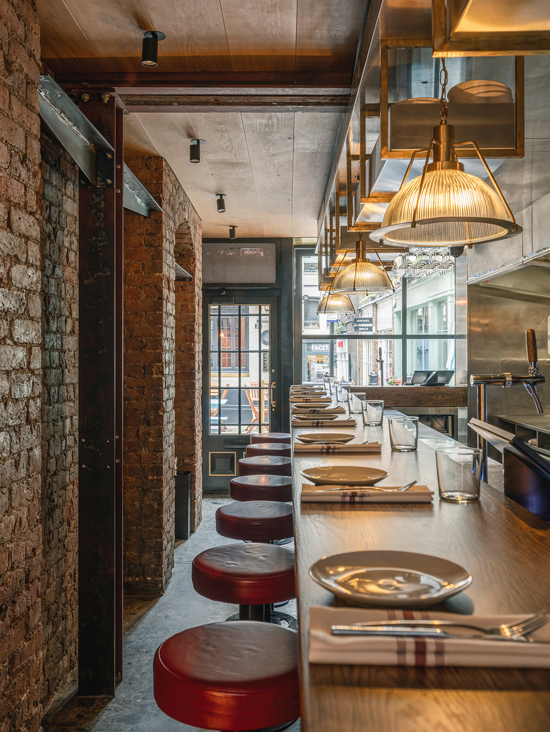 Long bar table with stools in a contemporary gastro bar.