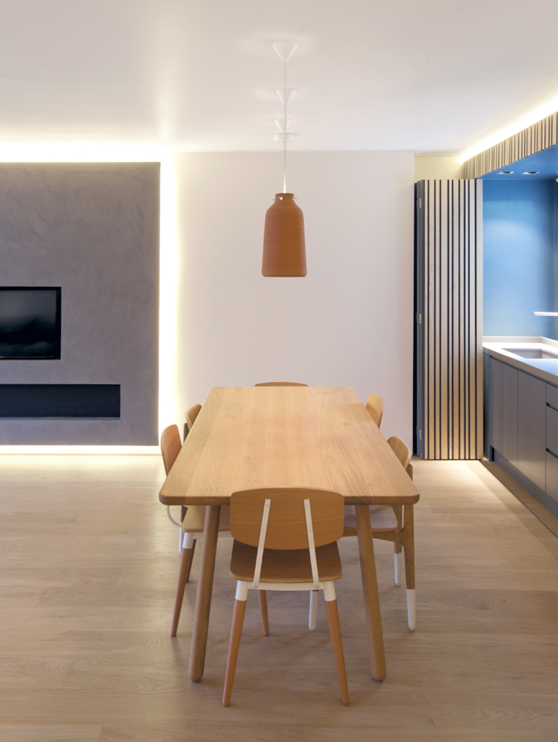 Contemporary dining area with a dining table and chairs.