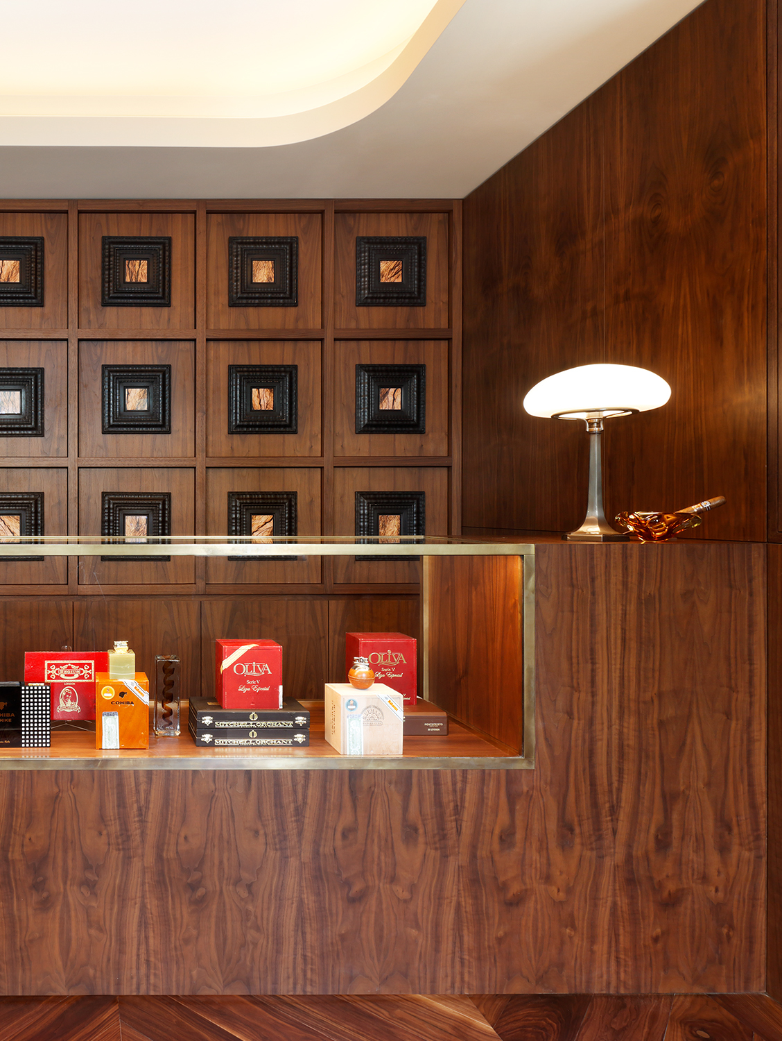 Cigar lounge counter with bespoke timber panelling.