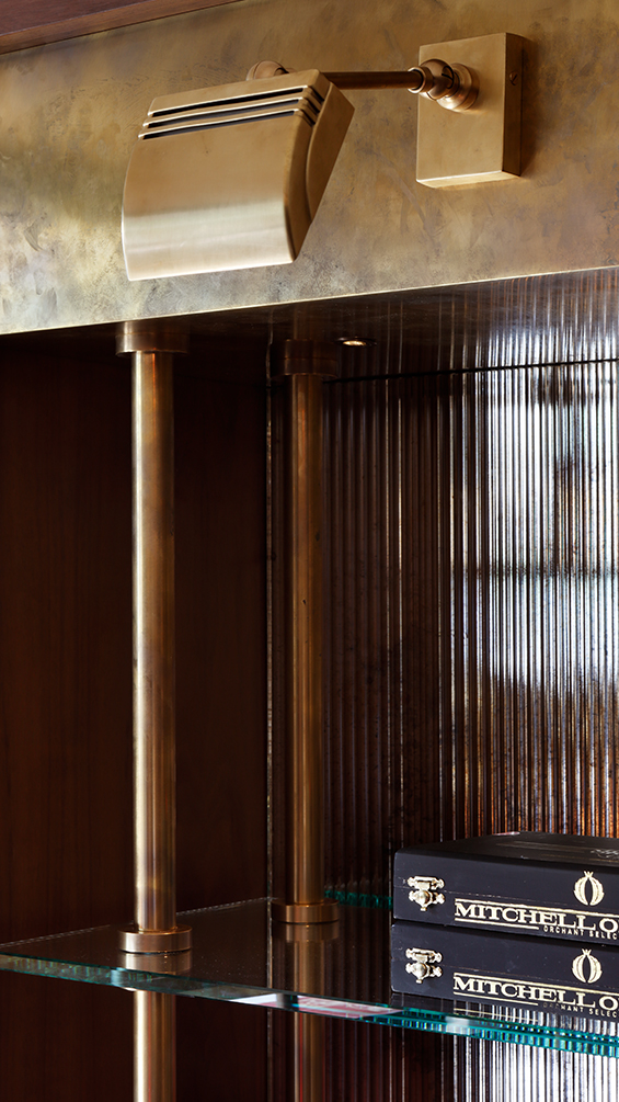 Luxury cigar lounge glass shelf with brass.