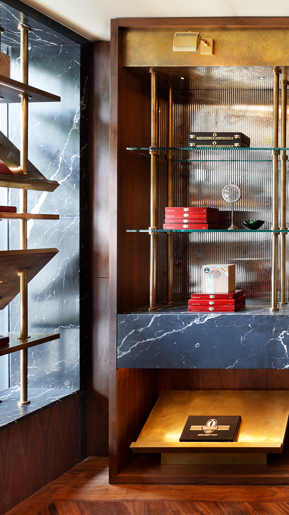 Luxury cigar lounge glass shelf with brass.
