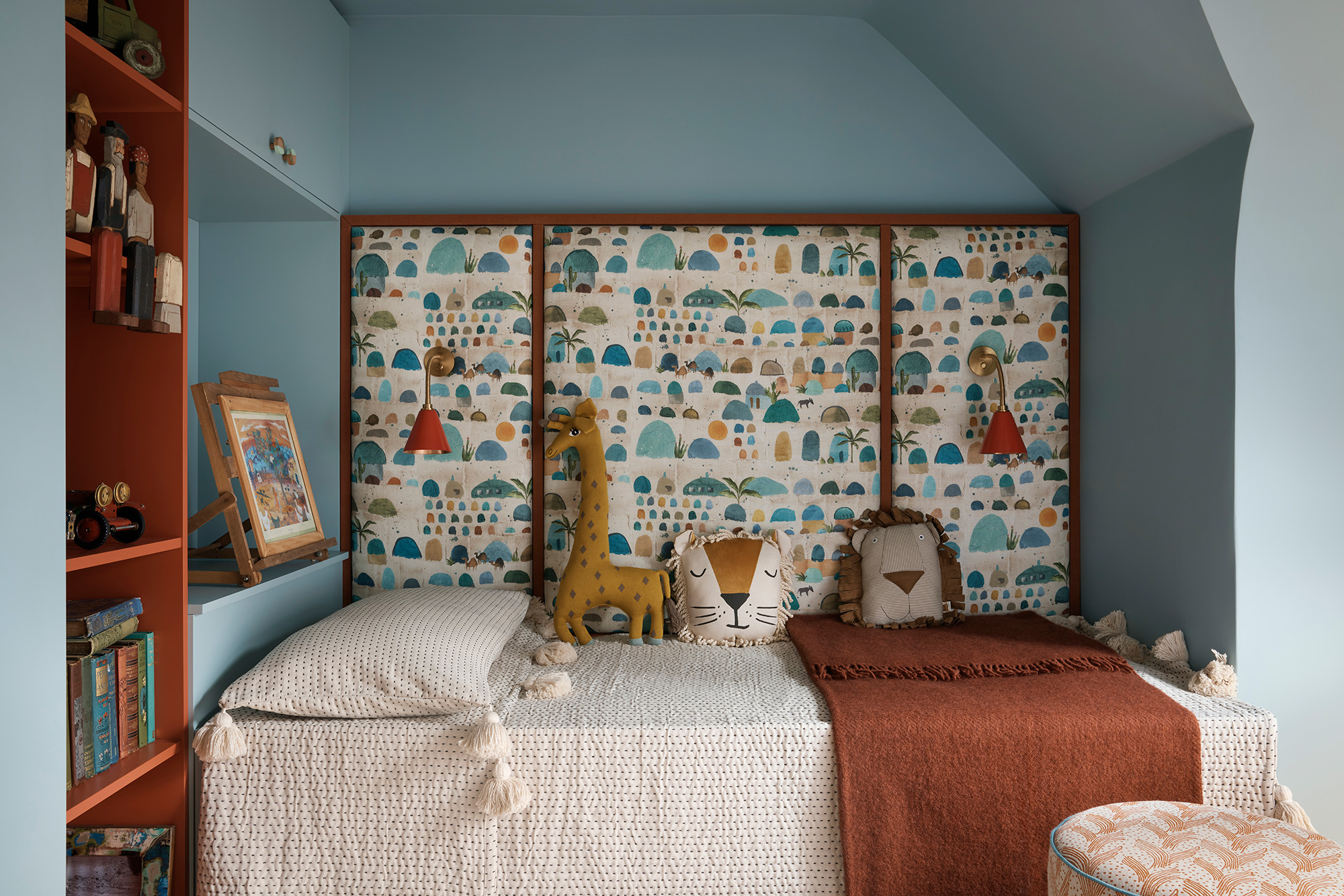 Contemporary children’s bedroom with blue walls.