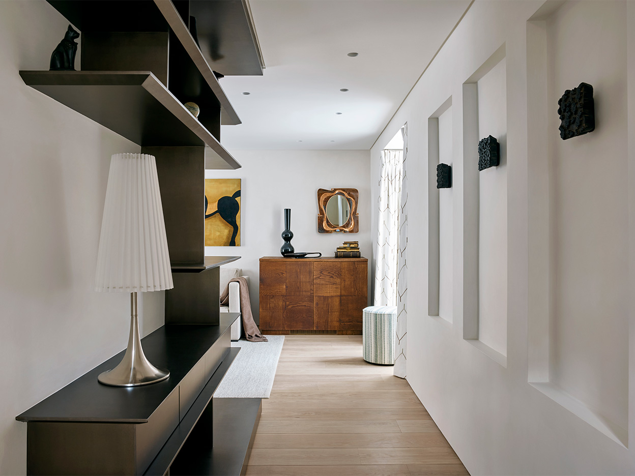 Contemporary small hallway design and decoration with bespoke cabinetry.