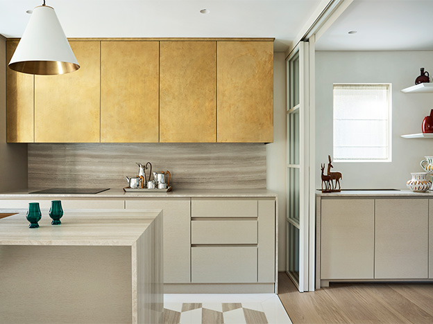 Windsor Way - Kitchen. Bespoke kitchen design with silver travertine cabinetry and brass finishes London.